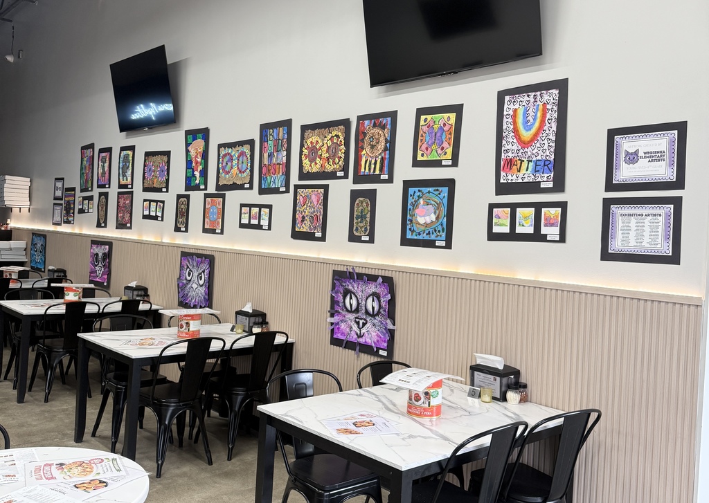 student artwork hanging at Francescas pizzeria