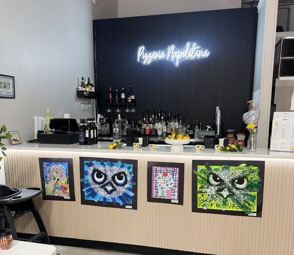 student artwork hanging at Francescas pizzeria