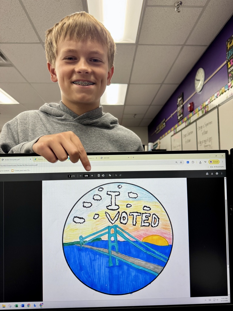 aiden stork and his design for the i voted michigan sticker contest