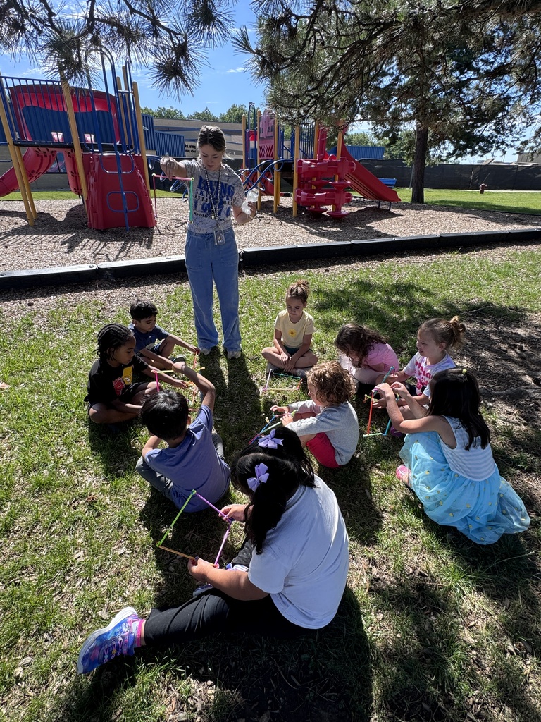students working outside to identify animals in their square