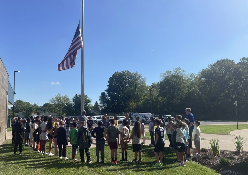 fourth grade students at gudith at flagpole