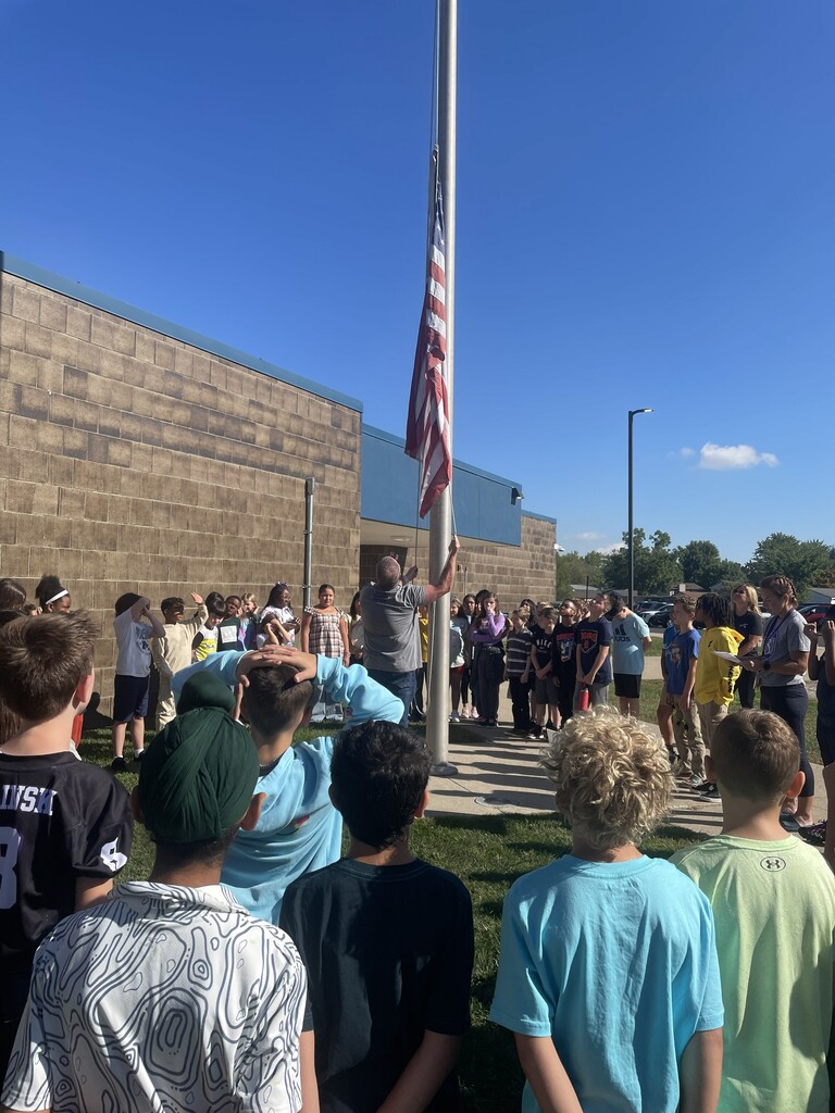 fourth grade students at gudith at flagpole