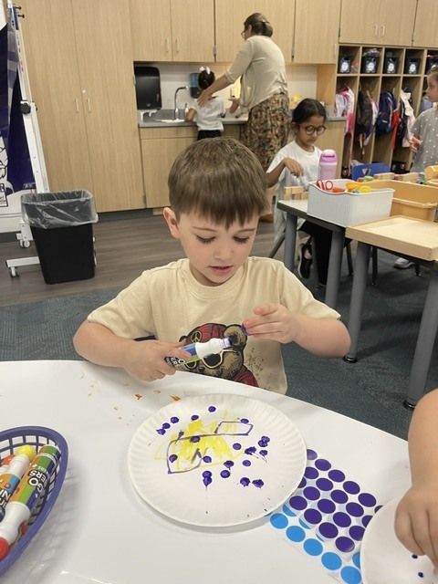 students putting dots on plates