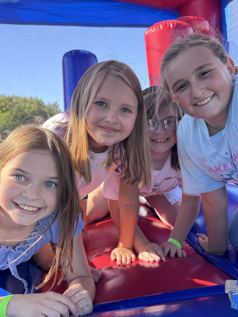 students in bounce house