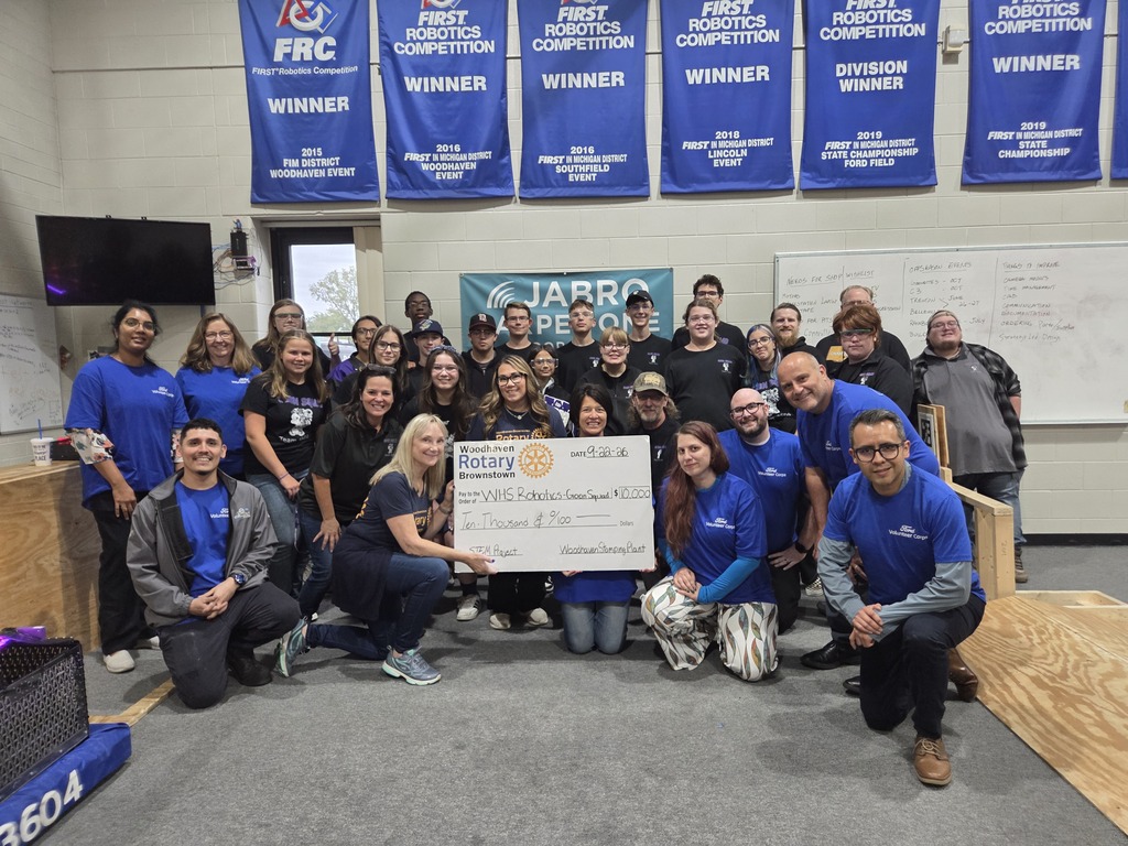 ford stamping and rotary volunteers at robotics lab