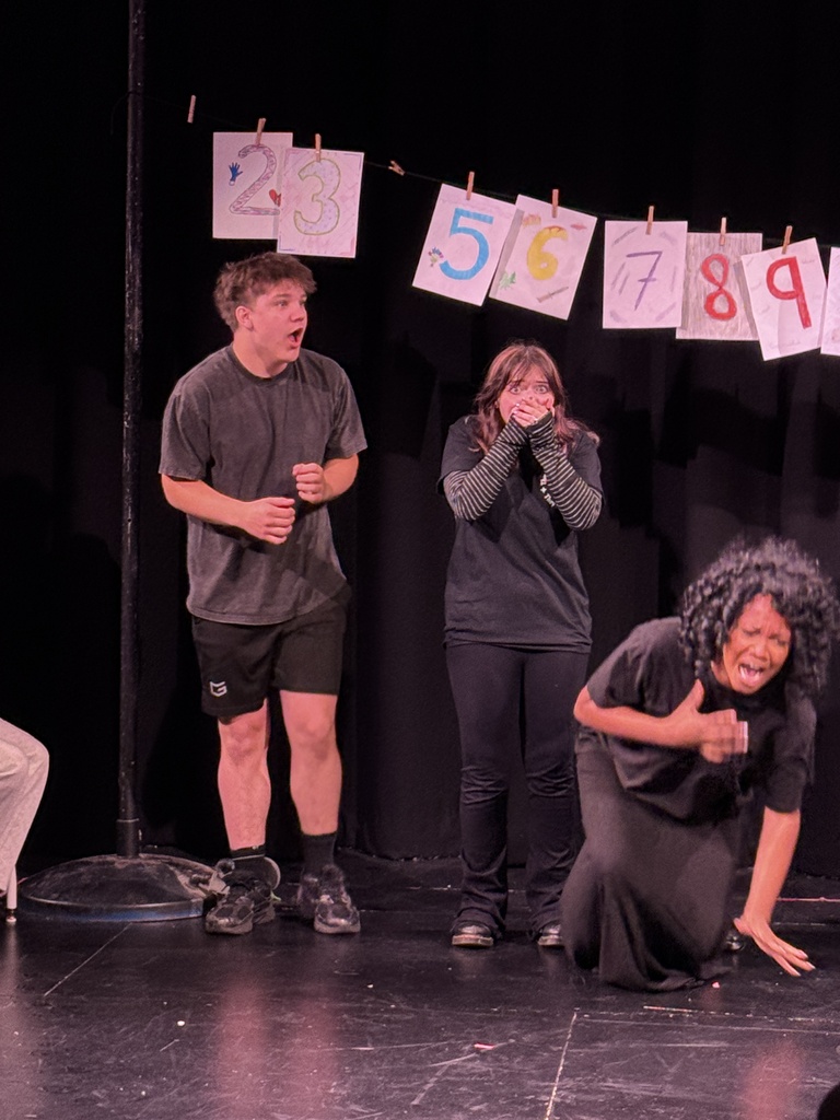 students in play acting 