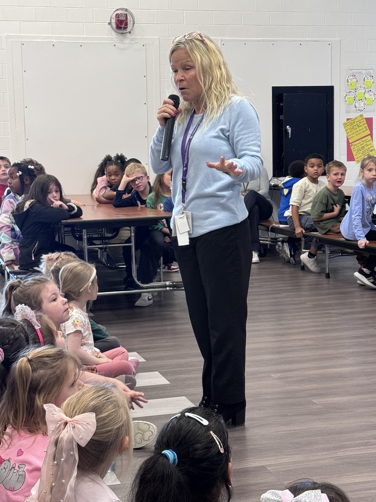 woman talking to students