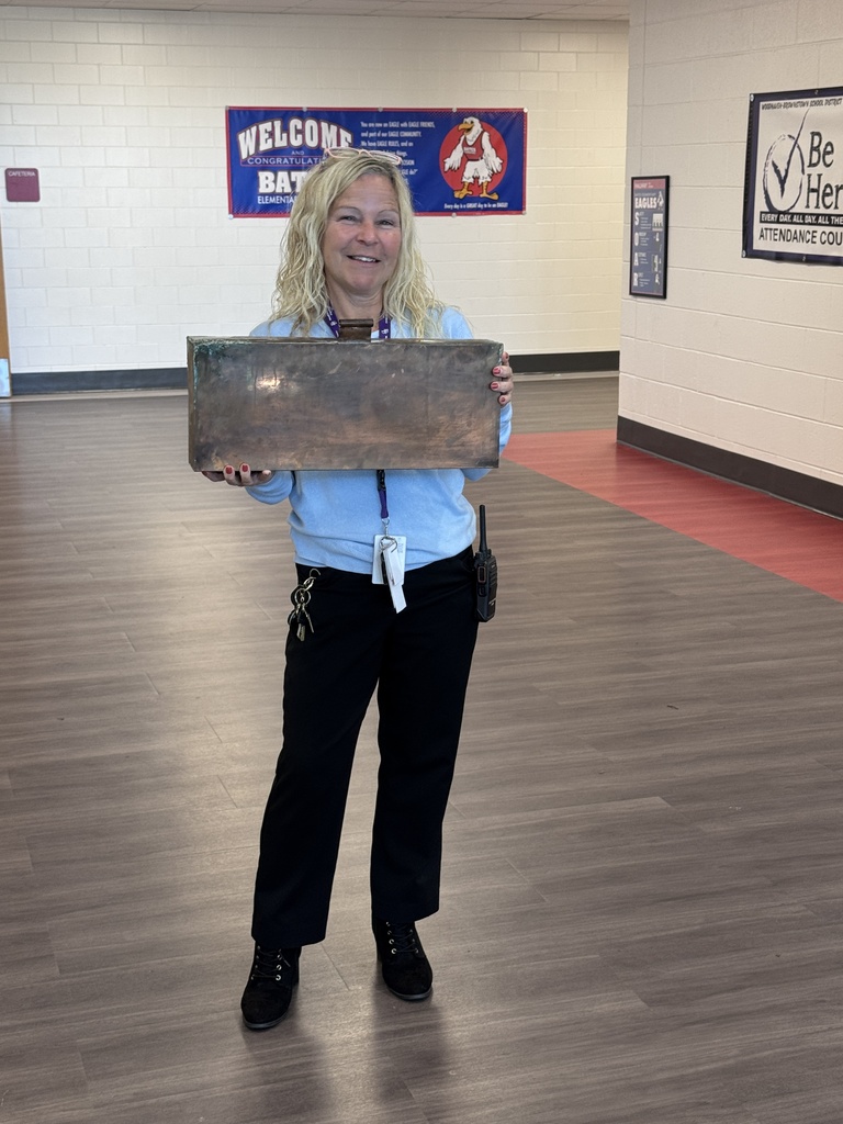woman holding a big metal box
