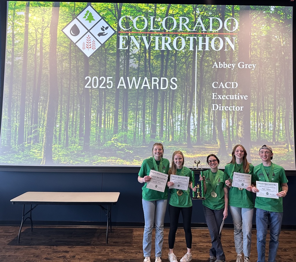 Envirothon students pose with their awards and trophy.