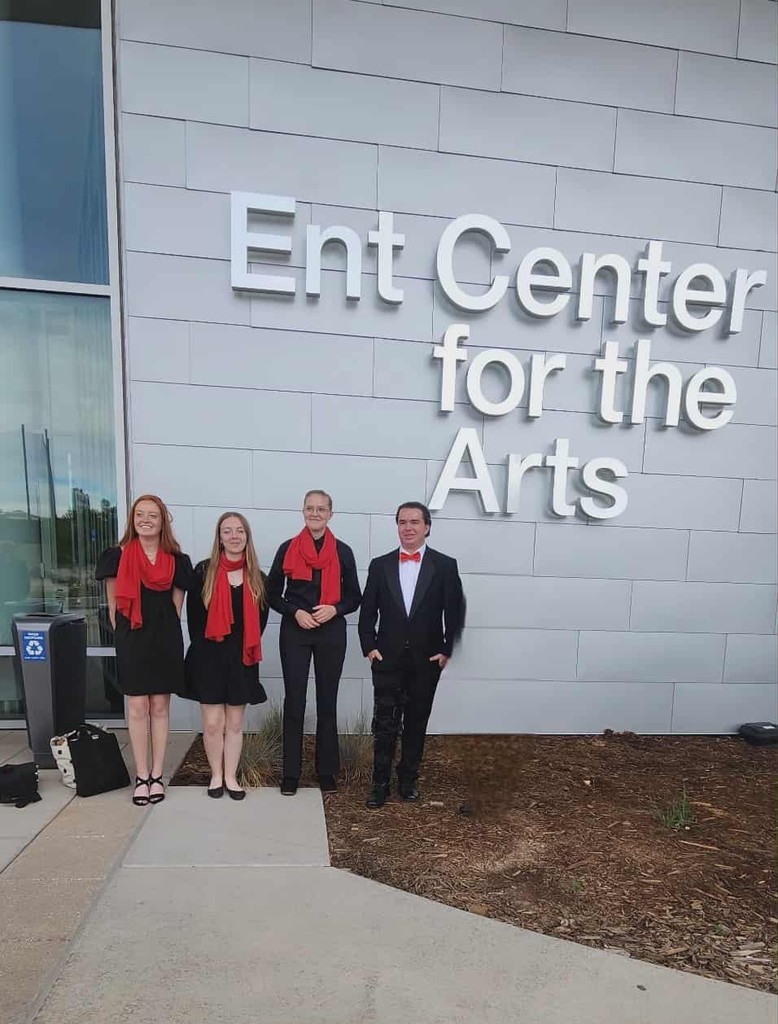 Four Sr HS students posing outside of the Ent Center for the Arts