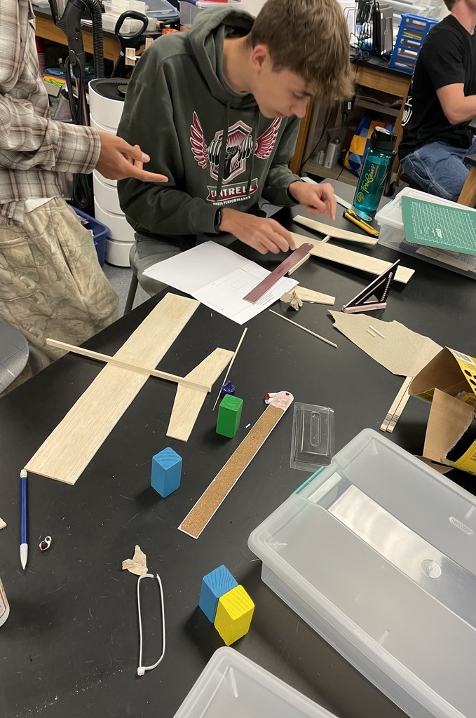 An Engineering student building balsa wood glider