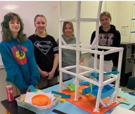 8th graders in Mr. Schultz's STEAM class with their paper roller coaster