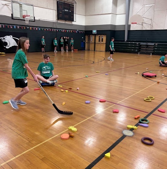 PE students playing their version of curling