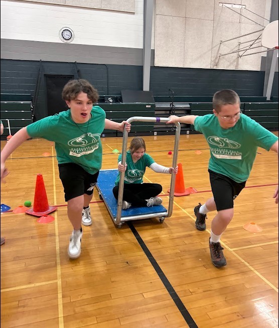 PE students simulating a bobsled race