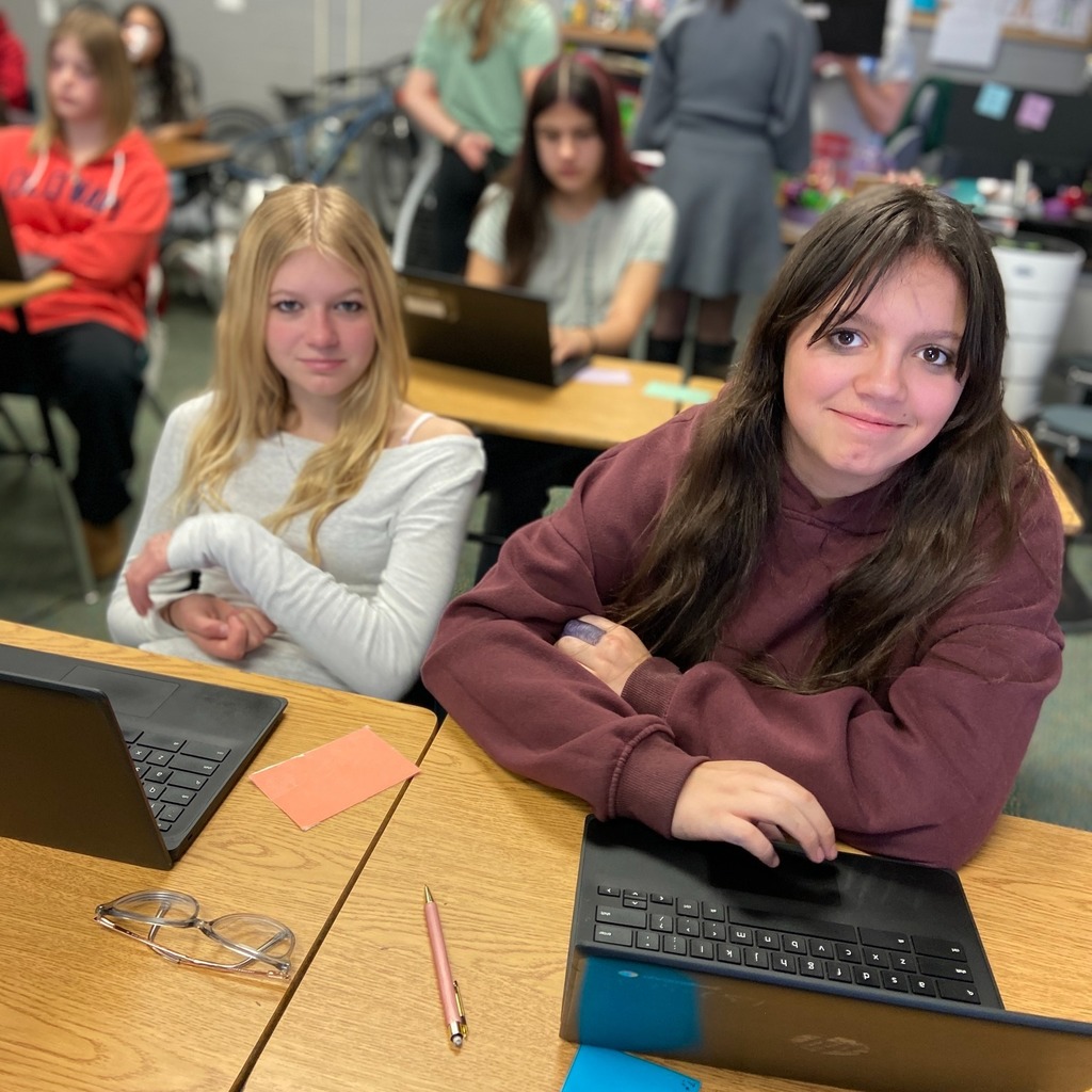 Two students peer editing during English class