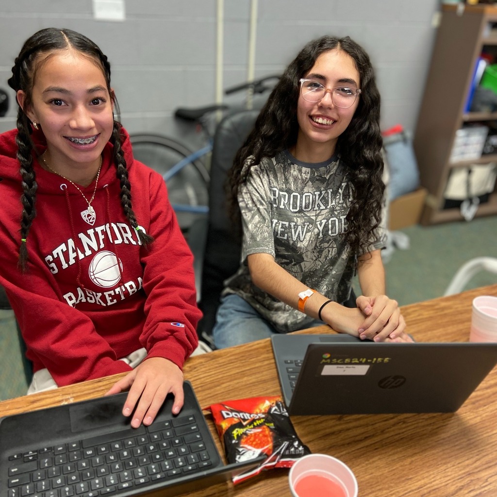 Two students peer editing during English class