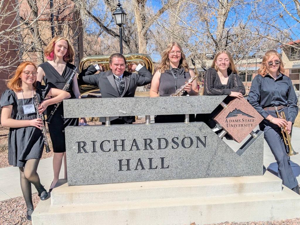 Band students posing outside of Richardson Hall at Adams State University