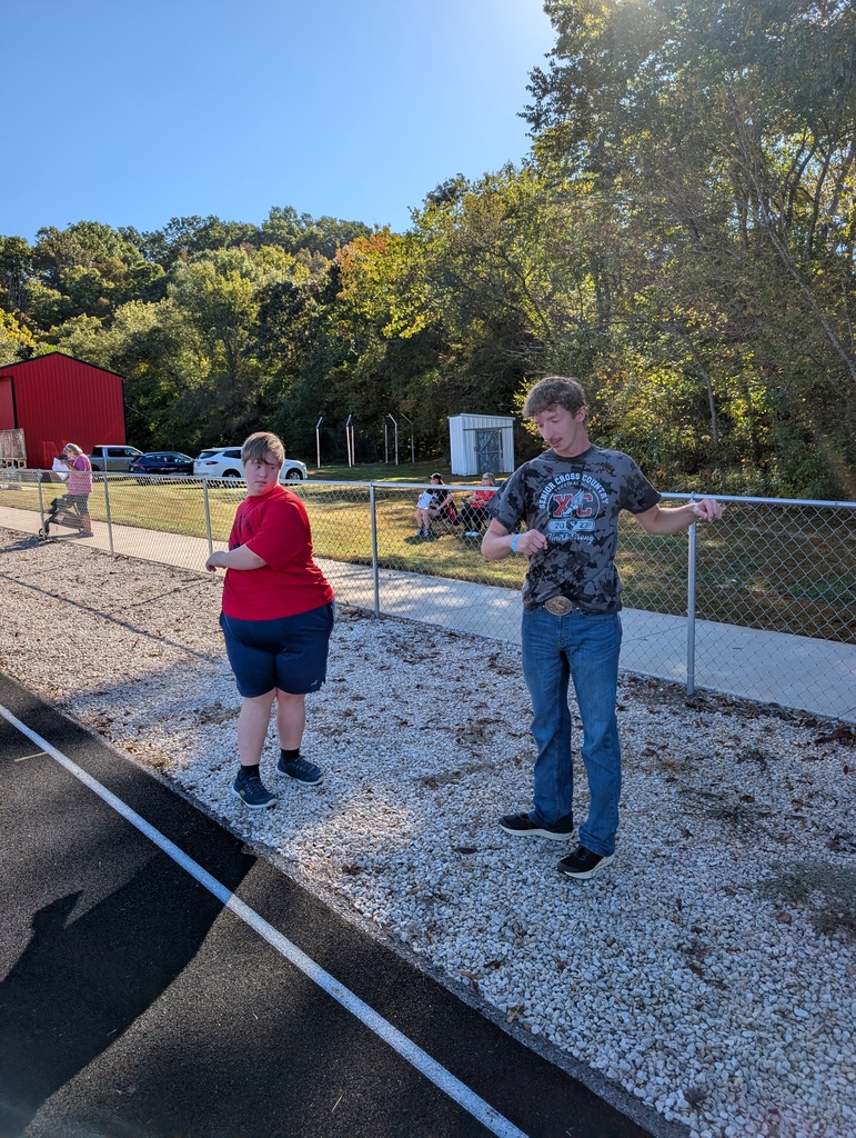 Caleb Wilkinson, left, warms up under the direction of big brother, Seth. The two both raced at Woodland last week--Seth in the Woodland CC Invitational and Caleb in the Goodwill Games