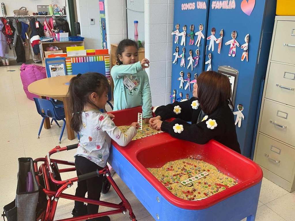 Students using the sensory bin