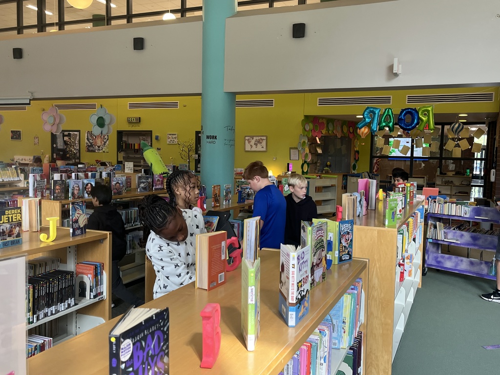 Chromebook care tips and checking out books at the Woodland Intermediate LRC
