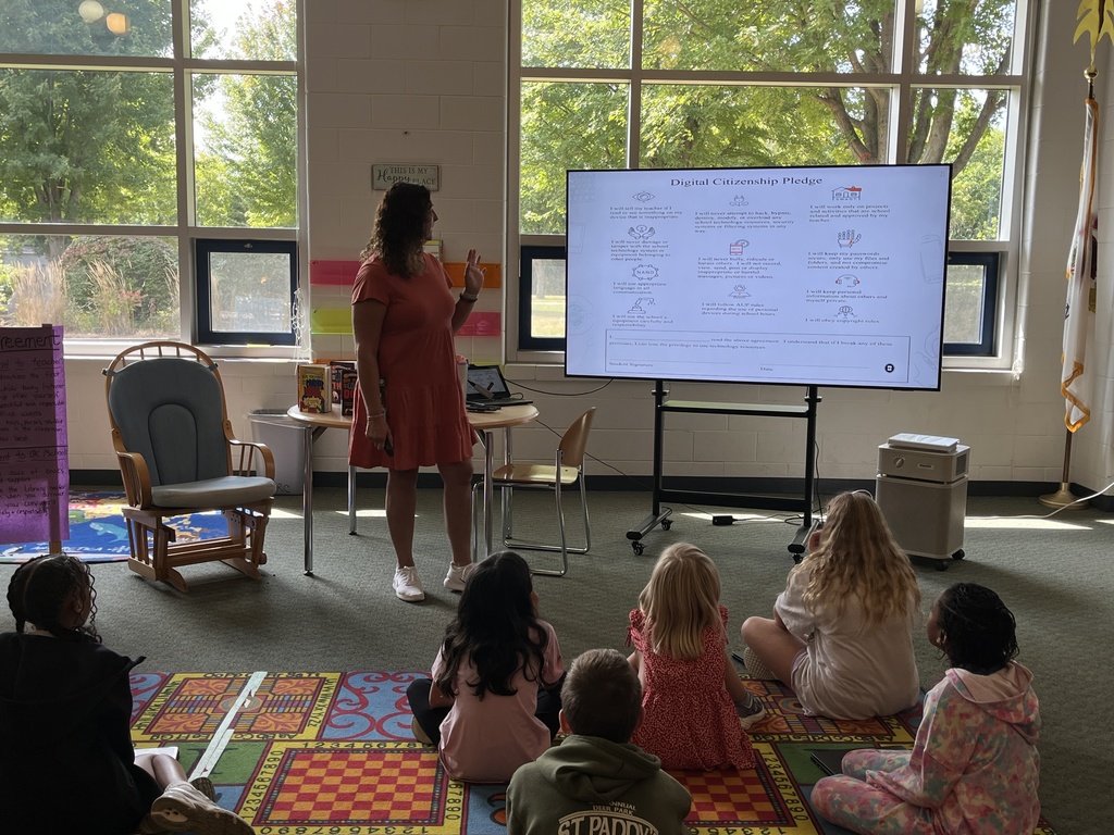 Chromebook care tips and checking out books at the Woodland Intermediate LRC