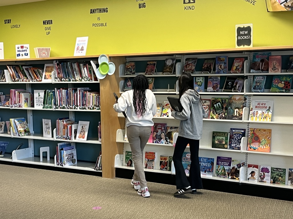 Chromebook care tips and checking out books at the Woodland Intermediate LRC