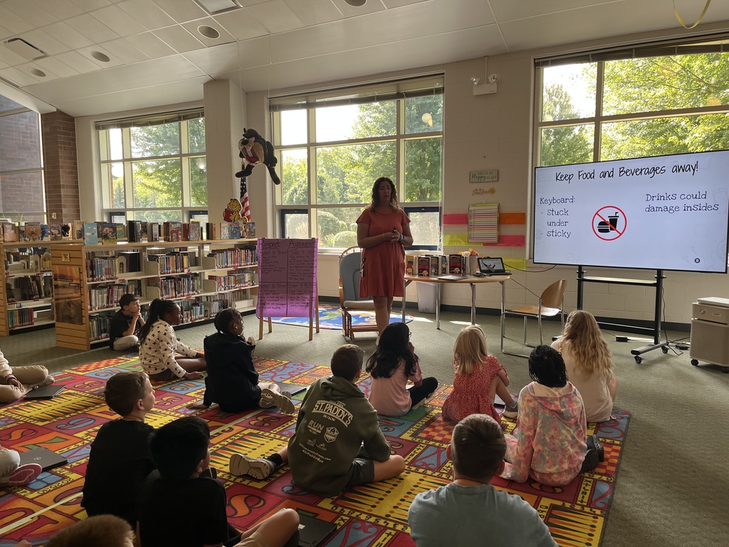 Chromebook care tips and checking out books at the Woodland Intermediate LRC