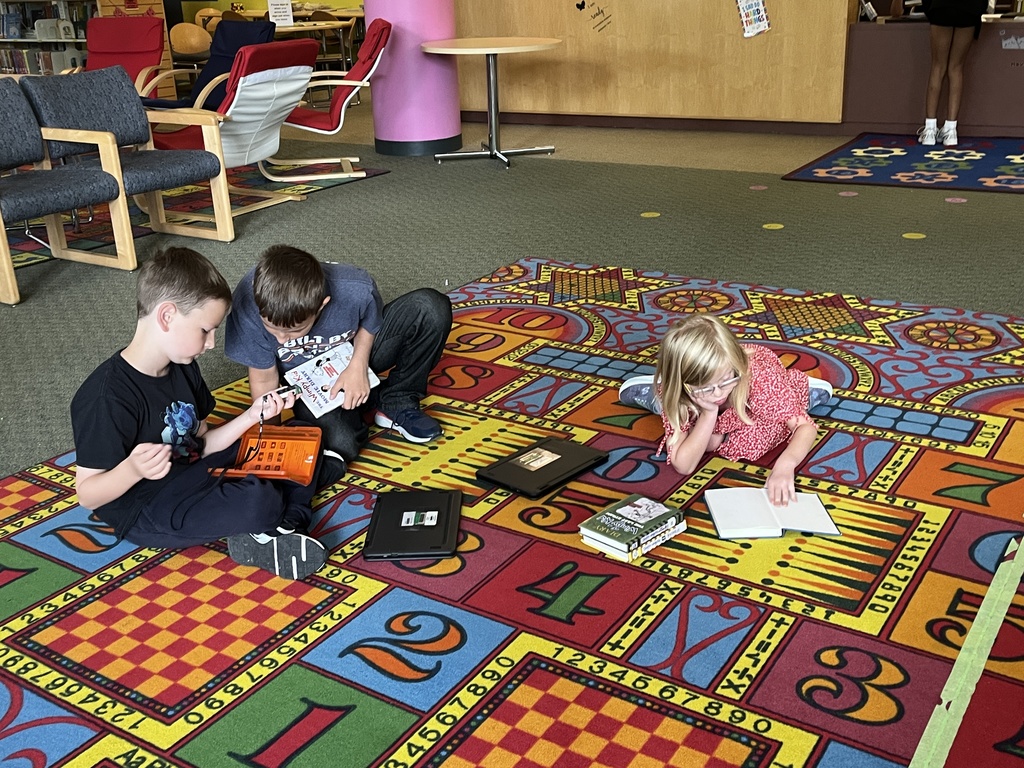 Chromebook care tips and checking out books at the Woodland Intermediate LRC