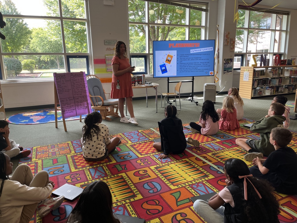 Chromebook care tips and checking out books at the Woodland Intermediate LRC