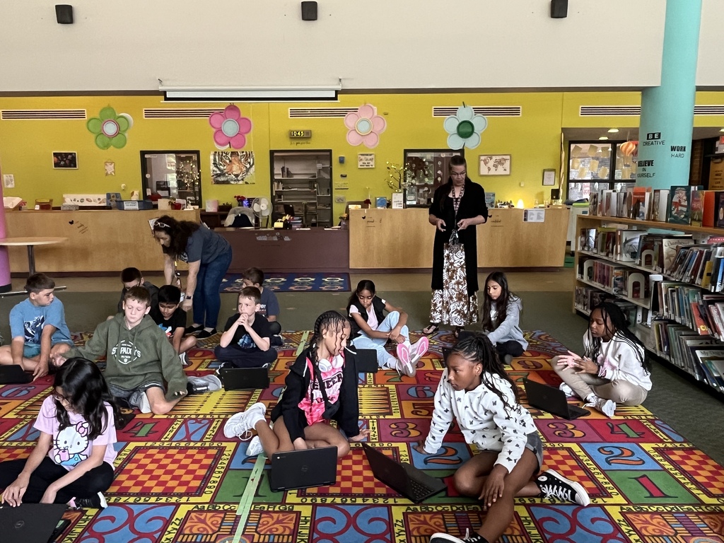 Chromebook care tips and checking out books at the Woodland Intermediate LRC