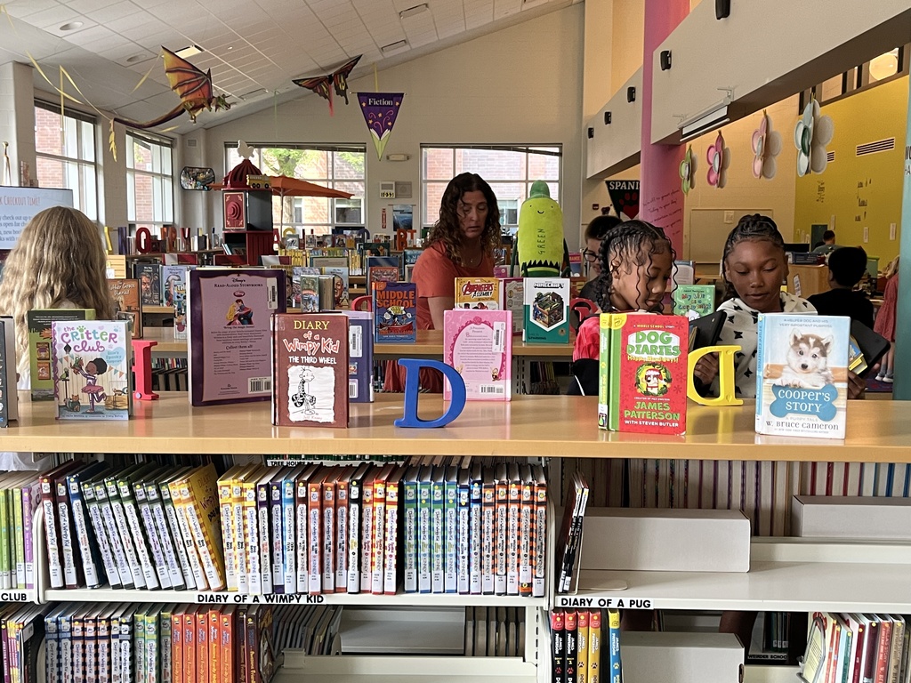 Chromebook care tips and checking out books at the Woodland Intermediate LRC