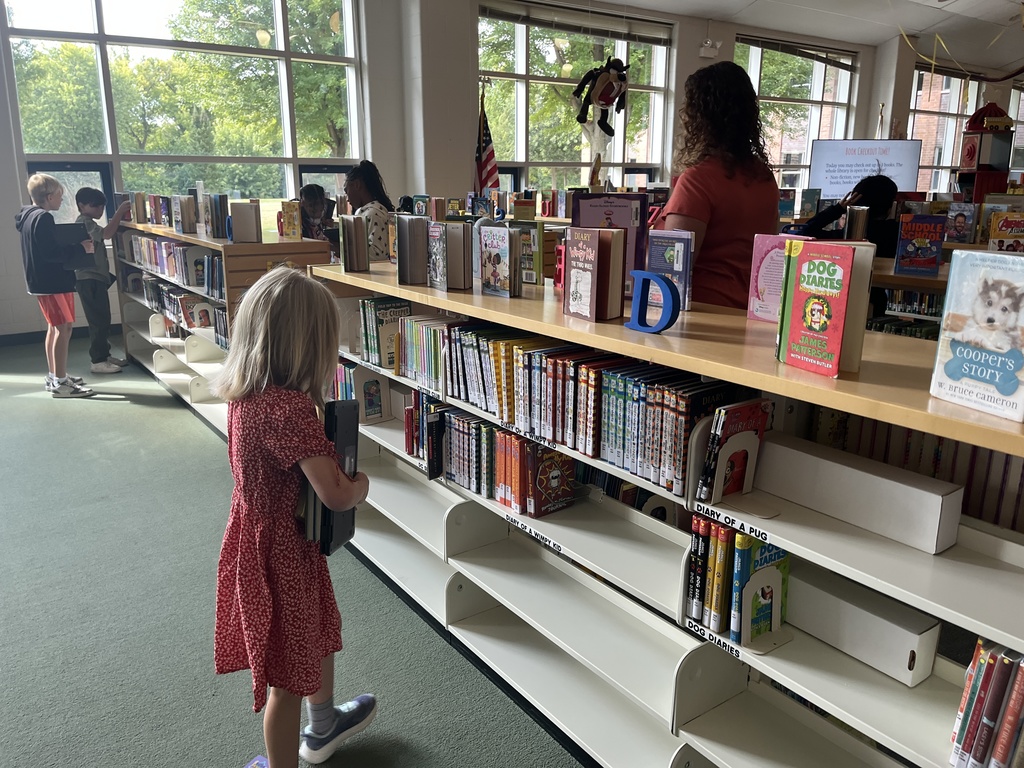 Chromebook care tips and checking out books at the Woodland Intermediate LRC