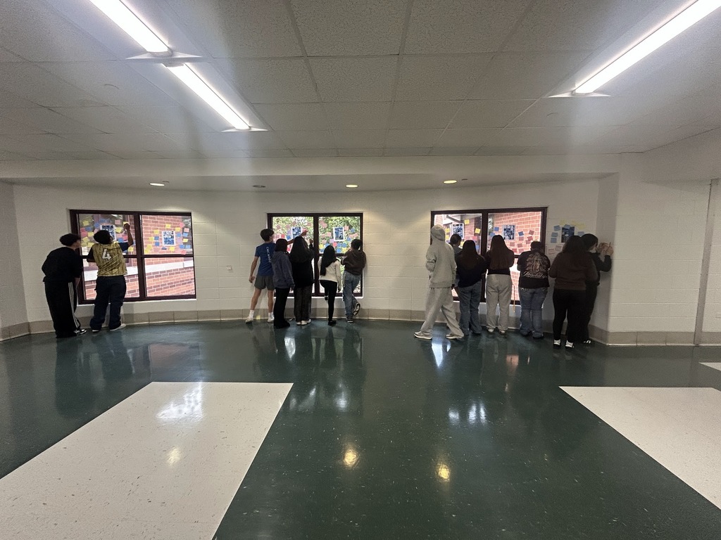 WMS English Language Arts students are observing images from a graphic novel and taking note of examples of foreshadowing.