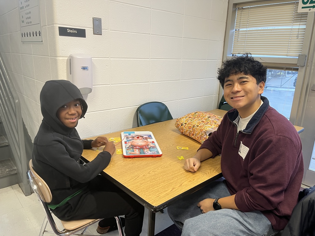 Warren High School Mentors working with Elementary students