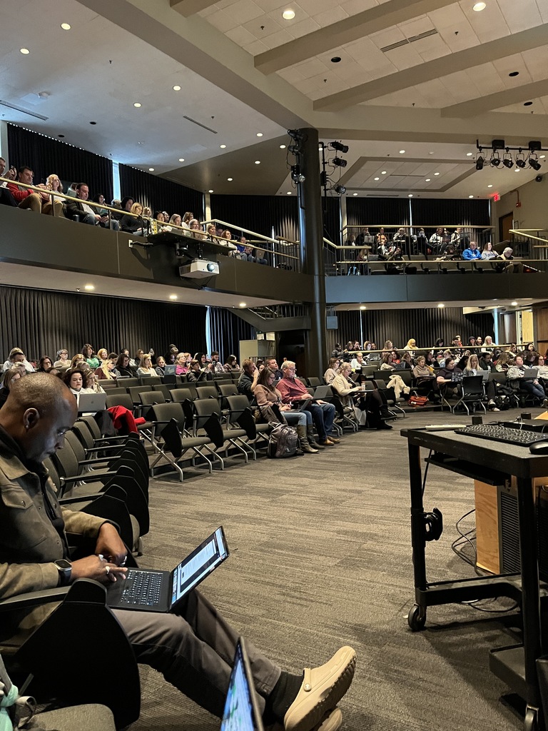 Woodland educators in an auditorium for training