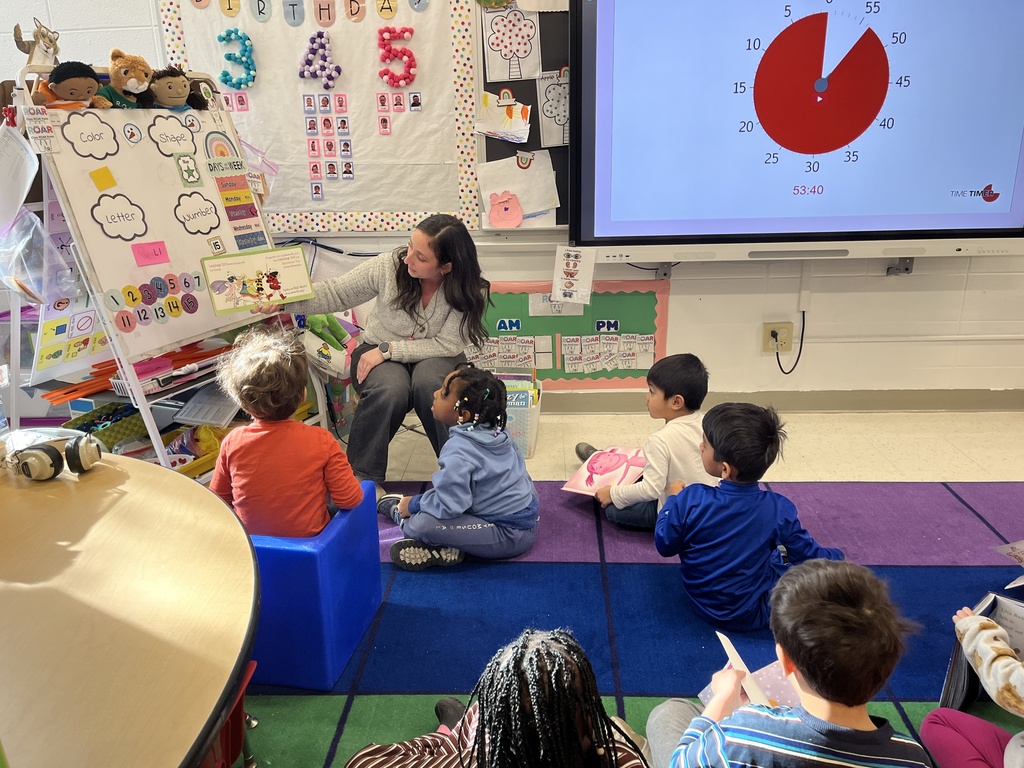 Primary teacher reads to students