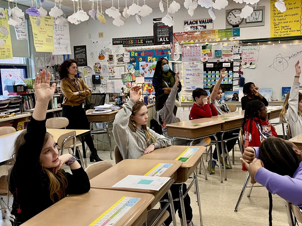 Ms. Weiland's class discusses solar power with Mr. Sheldon at Woodland Intermediate