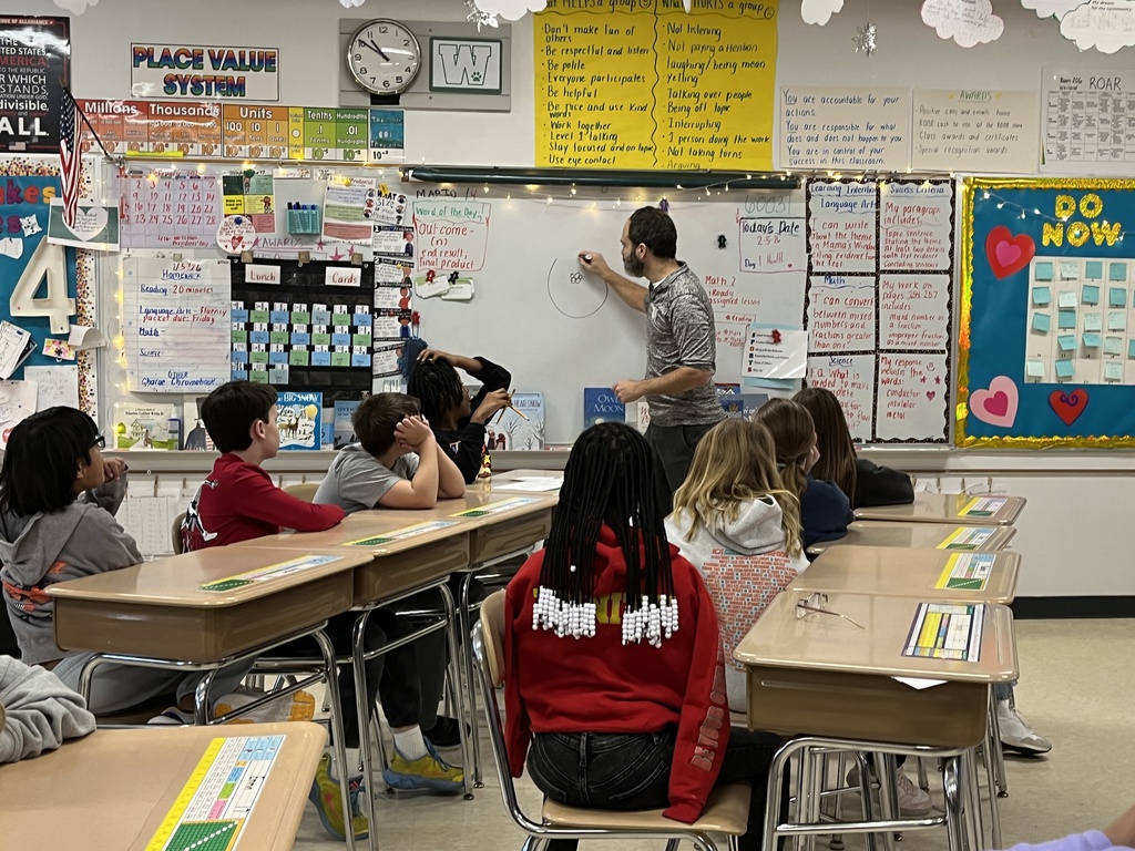 Ms. Weiland's class discusses solar power with Mr. Sheldon at Woodland Intermediate