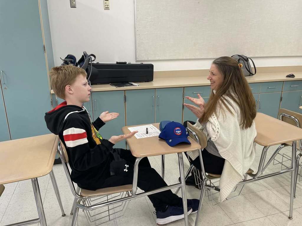 Students in ASL Club practicing conversations