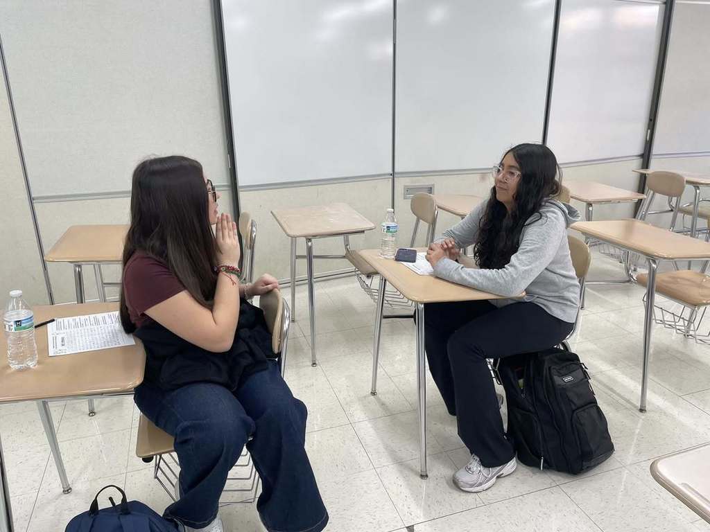 Students in ASL Club practicing conversations