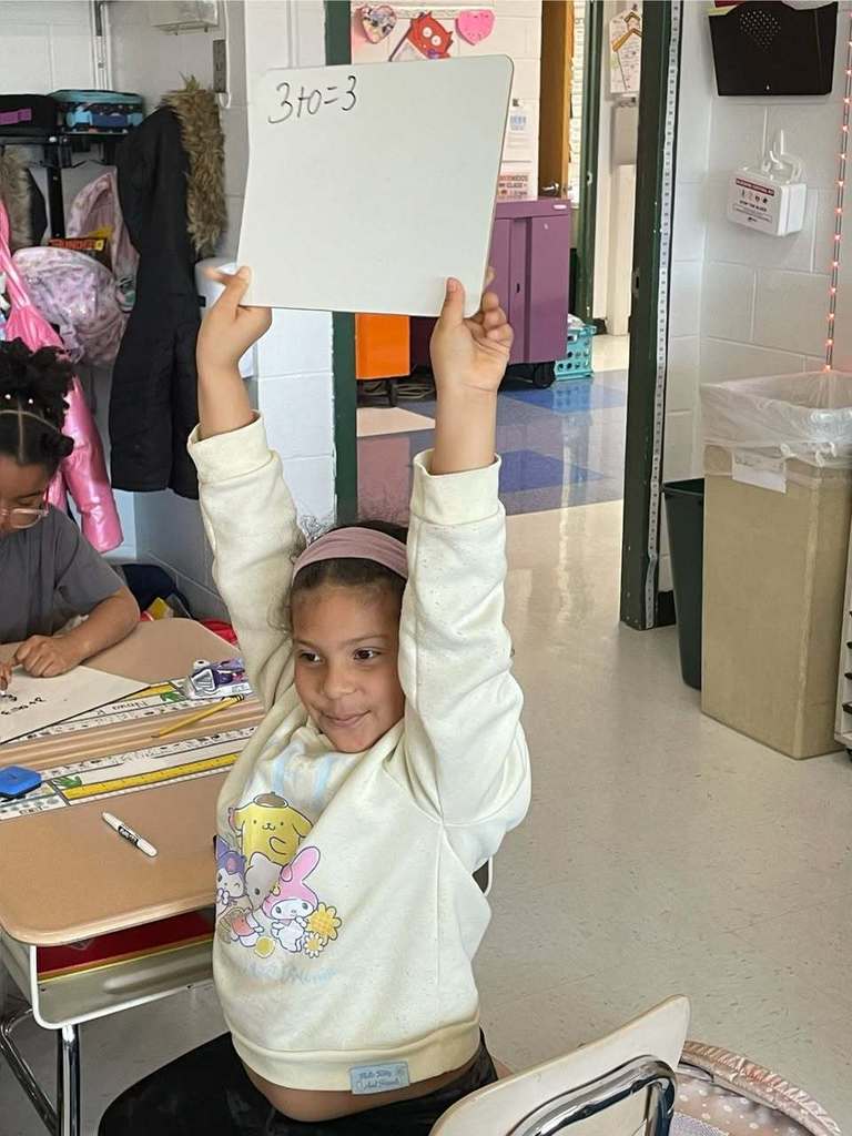 Students working on math problems in class 