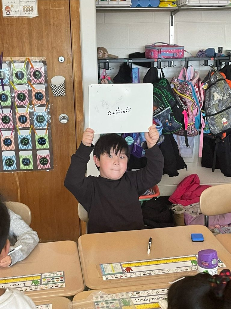 Students working on math problems in class 