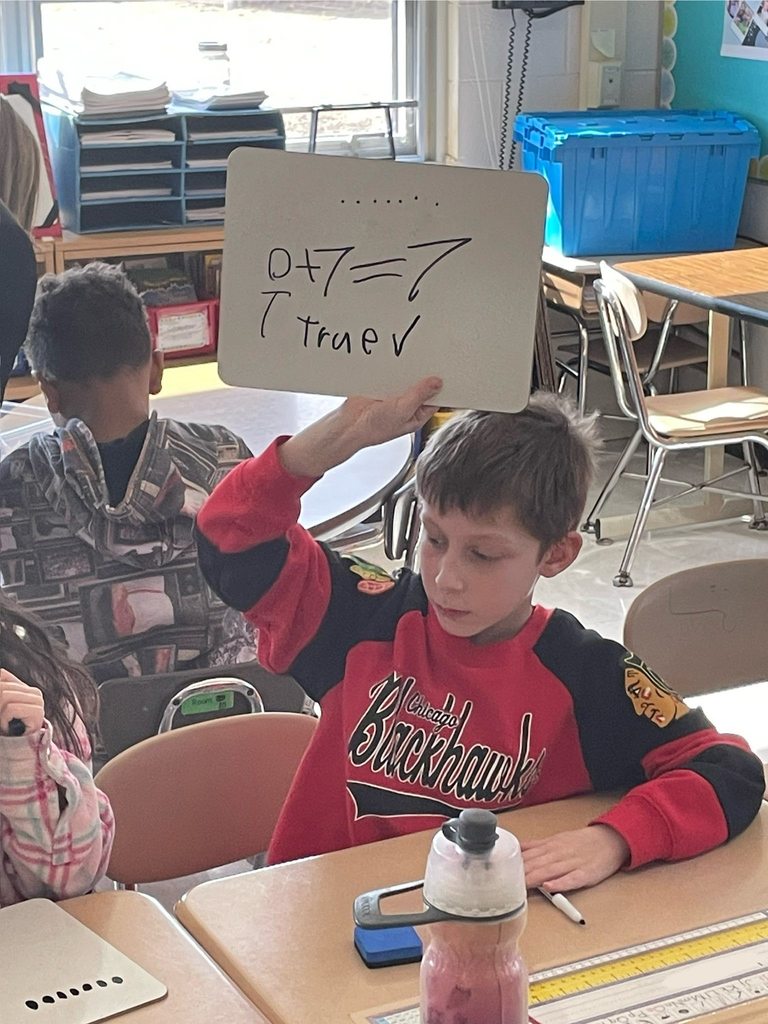 Students working on math problems in class 