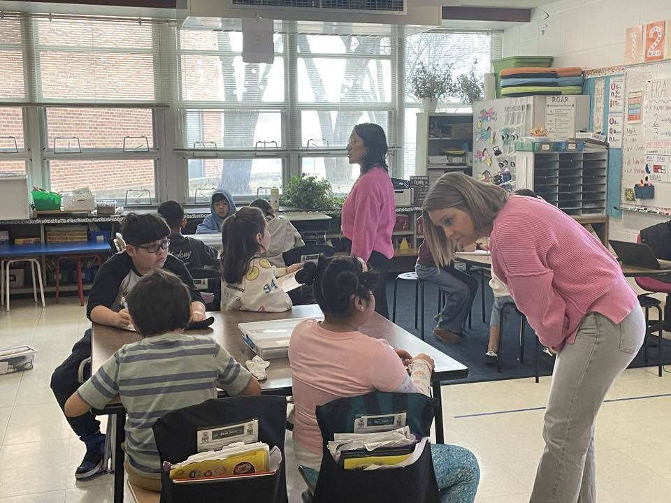 Ms. Lazcano and Ms. Coda with students