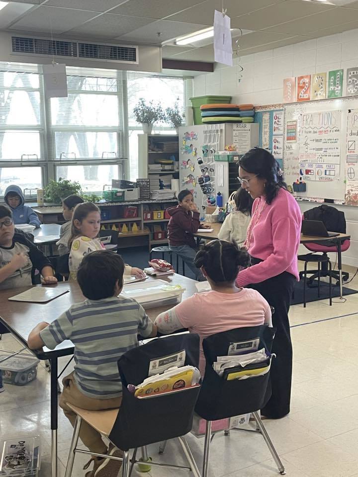 Ms. Lazcano with students