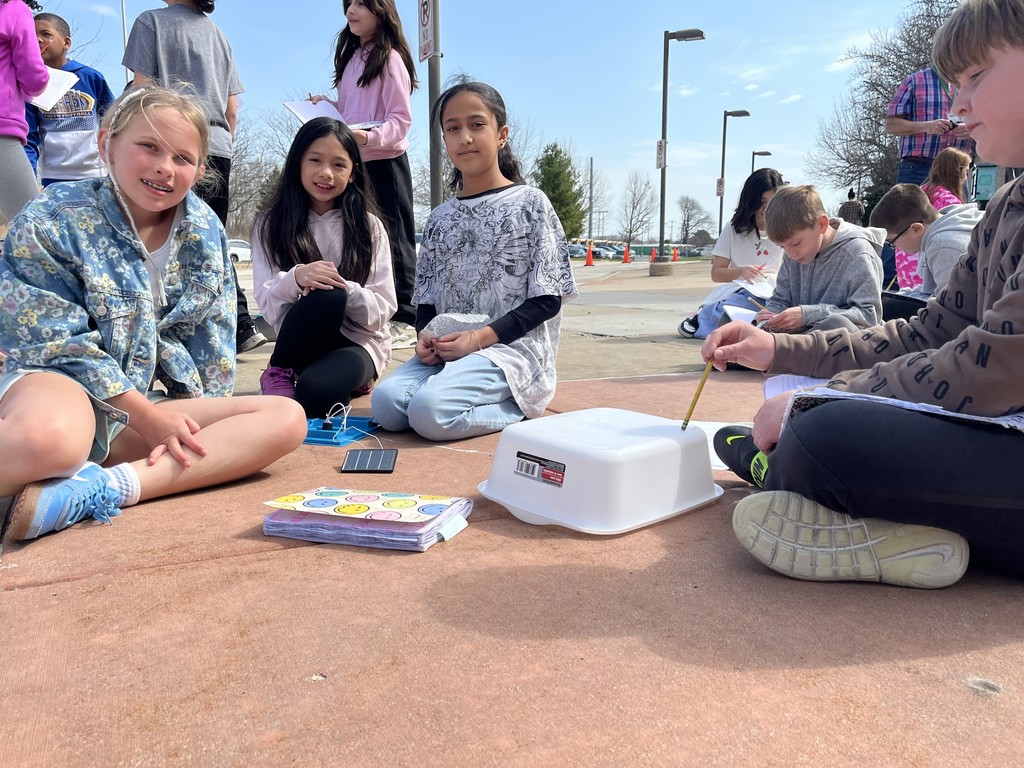 Students work in groups outside on a project to get the motor to run using solar energy at Woodland Intermediate, March 2026