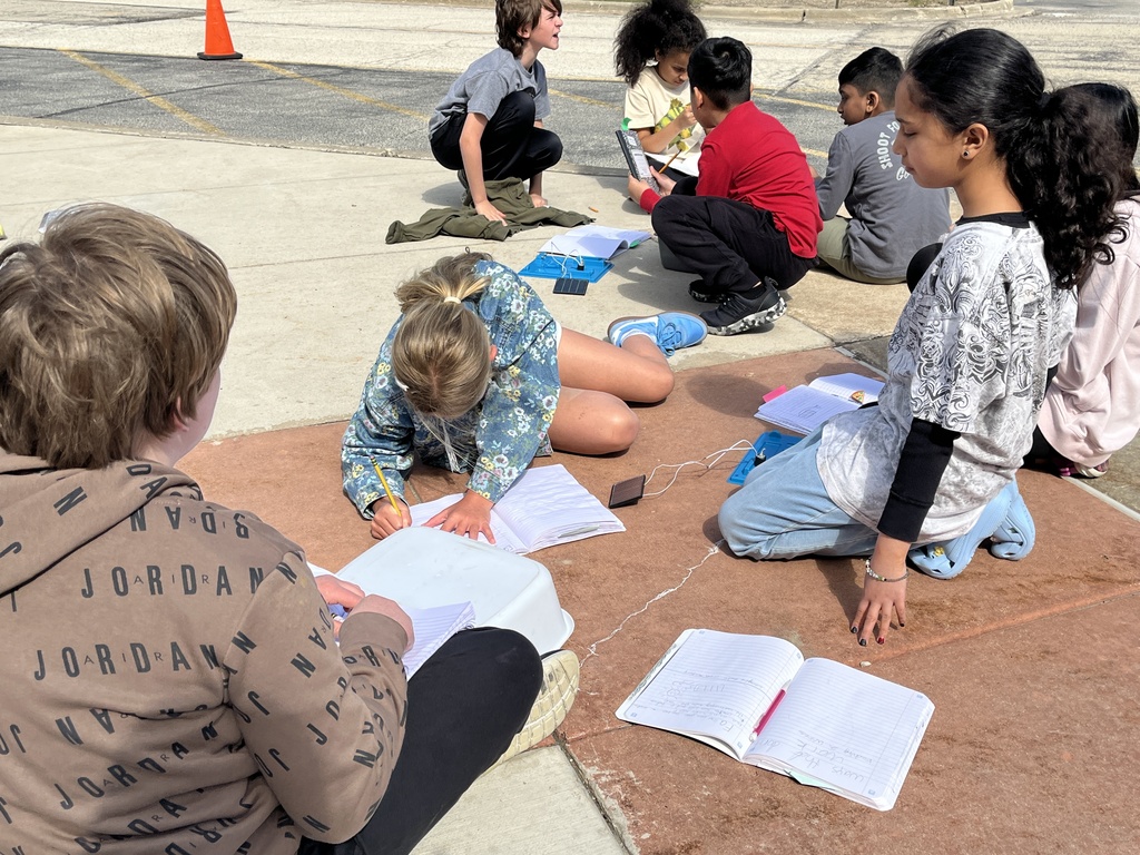 Students work in groups outside on a project to get the motor to run using solar energy at Woodland Intermediate, March 2026