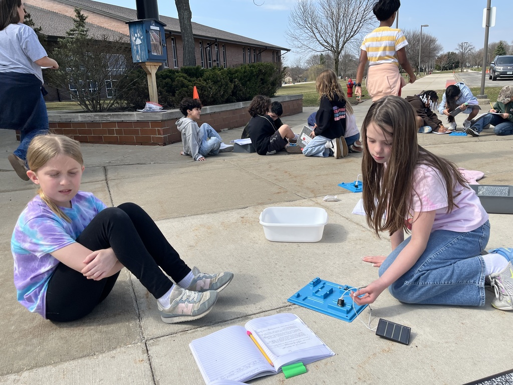 Students work in groups outside on a project to get the motor to run using solar energy at Woodland Intermediate, March 2026