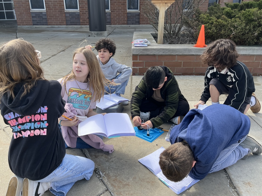 Students work in groups outside on a project to get the motor to run using solar energy at Woodland Intermediate, March 2026