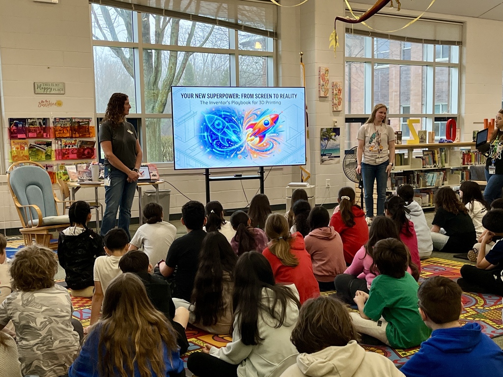 students learn about 3D printing during a presentation in the school library